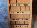 a wooden cabinet that has a clock on top of it
