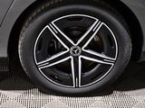 a close up view of a car ' s wheel on the ground