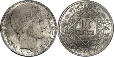 a close up of a coin with a woman ' s face on it