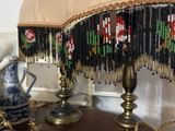 two lamps that are on a table in a room
