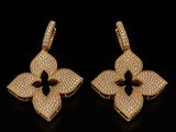 a pair of yellow gold earrings with white diamonds