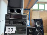 many speakers stacked on top of each other in a room