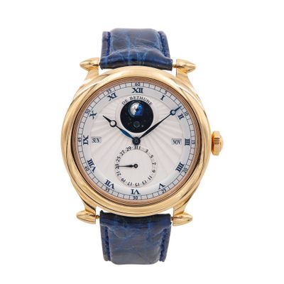 a close up of a wrist watch with a blue strap
