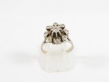 a close up of a diamond ring on a white surface