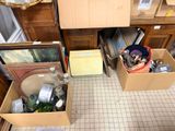 two boxes that are sitting on the floor in a room