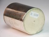 a metal container with a sticker on it