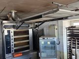 a room with a bunch of ovens in it