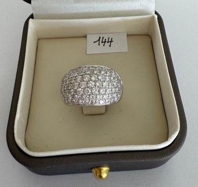 a diamond ring in a box on a table