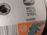 a picture of a metal grinding disc on a table