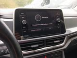 the dashboard of a car with a car radio and a steering wheel
