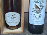 two bottles of wine sitting next to each other on a table