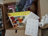 a cardboard box with a keyboard and other items in it