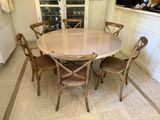 a table with four chairs around it in the kitchen