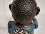 a small figurine of a boy with a ball on his head