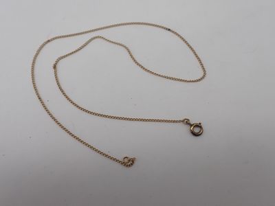 a gold chain with a small diamond pendant on it