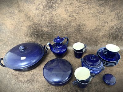 a lot of blue dishes and cups on the table