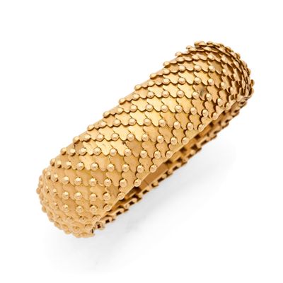 a close up of a gold ring on a white background