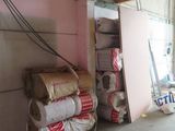 several rolls of toilet paper are stacked up in a garage