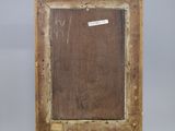 an old wooden easel with a piece of wood on top of it