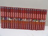 the complete set of anime books are lined up on a table