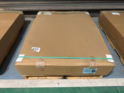 several boxes of cardboard are stacked on a pallet in a warehouse