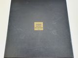 a black box with a gold label on it