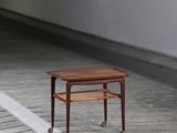 a small table that is sitting on a wooden floor
