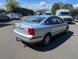 a silver car that is parked in a parking lot