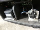 a close up of a car ' s front bumper with an air conditioner attached to it