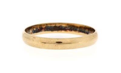 a close up of a gold ring on a white background