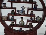 a display case with a lot of small objects on it