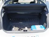 the back of a car with its trunk open and luggage in the trunk