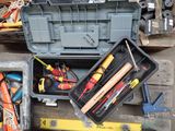 many different tools in a toolbox on the floor