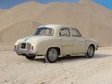 a old car that is parked in the middle of the desert