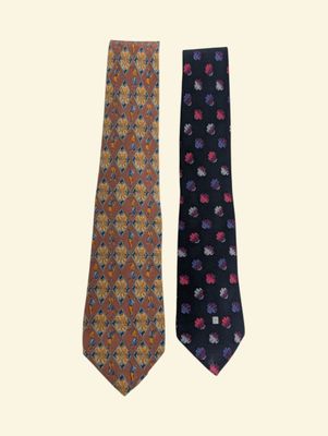 two ties with different designs on them on a white background