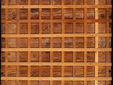a close up of a wooden wall with a pattern on it