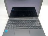a laptop with a keyboard on it sitting on a table