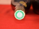 a close up of a bottle of beer on a table