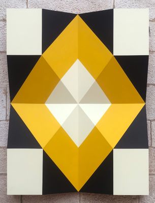 an image of a black and white and yellow geometric painting on a brick wall