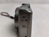 a close up of a digital camera on a table