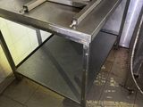 a machine that is sitting on a table in a kitchen