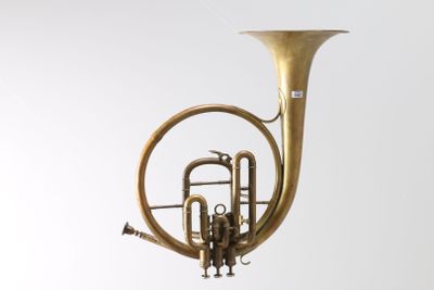 a brass instrument that is hanging from the ceiling