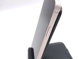 a close up of a cell phone on a stand