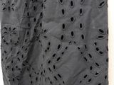 the skirt is black and has holes on it