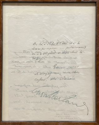 un vieux document portant des inscriptions, encadré dans un cadre en bois