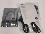 a package of headphones and a charger on the table