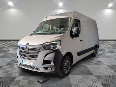 a white van that is parked on a checkered floor
