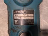 a close up of a blue machine with a label on it