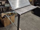 an image of a metal table with a sheet on top of it