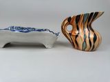 two vases sitting next to each other on a table